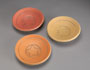 Circular stoneware platters 17 cm diameter [CP 1-2] yellow matt glaze; [CP 1-3] orange matt glaze [SOLD]; [CP 1-4] red matt glaze. $45 per item